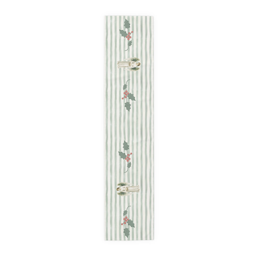 Angels and holly table runner, 72 inch in cotton twill, laid flat to show the angels and holly on a soft green stripe