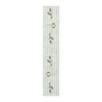 Angels and holly table runner, 90 inch in cotton twill, laid flat to show the angels and holly on a soft green stripe