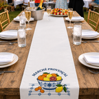 Marché Provençal table runner down a long wooden banquet table set with glasses