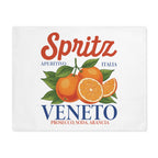 Spritz Veneto placemat laid flat, showing the Spritz Veneto label print with oranges on a white ground